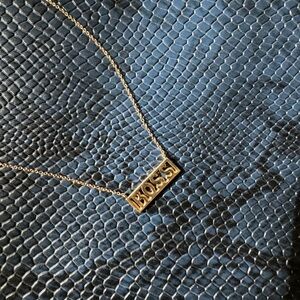 Small chain Gold necklace with “BOSS” in all caps